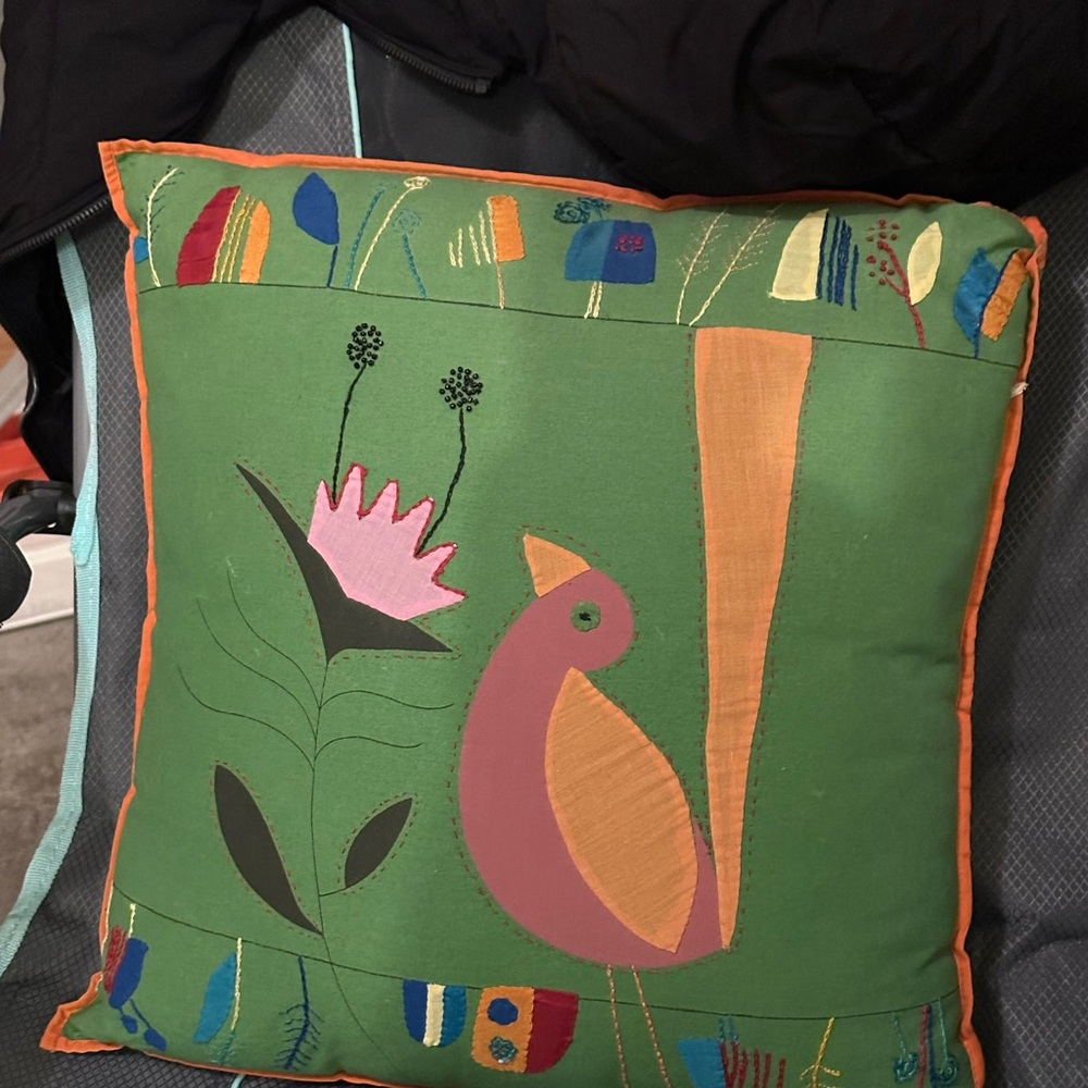 Vibrant Green Accent Pillow with Abstract Shapes and Floral Design